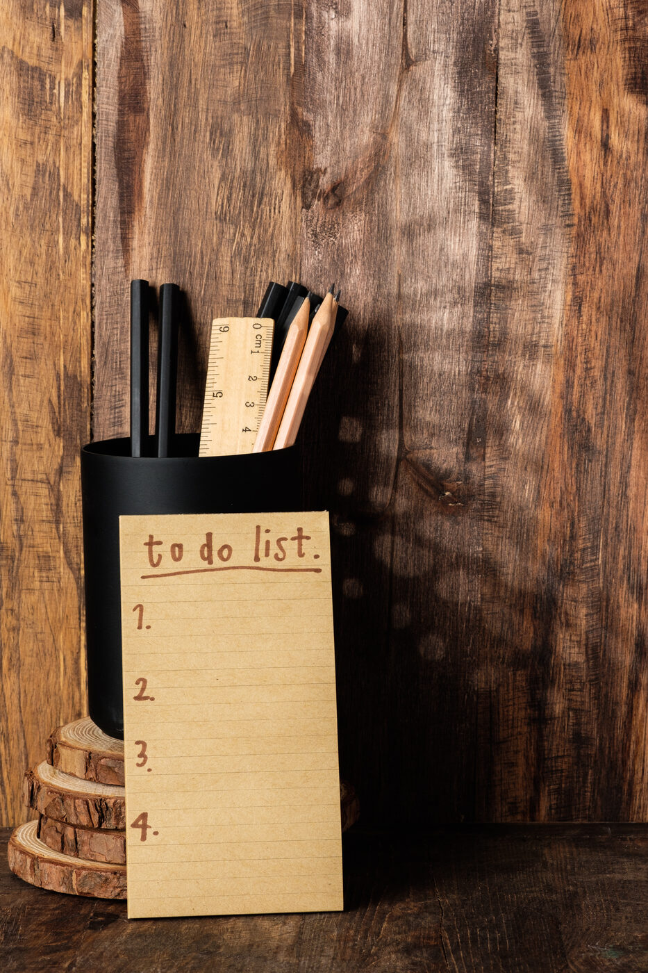 A wooden desk with stationery and a notepad, suggesting attention to home details.